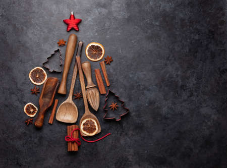Christmas greeting card with kitchen utensils and ingredients. Top view flat lay with space for your xmas greetings or holiday recipeの写真素材