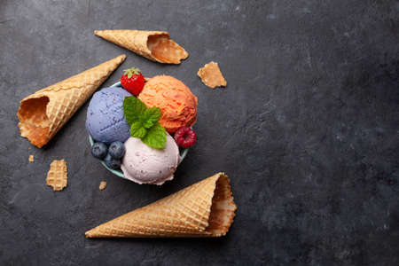 Berry and vanilla ice cream sundae. Top view flat lay with copy space