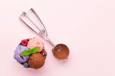 Berry, vanilla and chocolate ice cream sundae. Top view flat lay with copy space