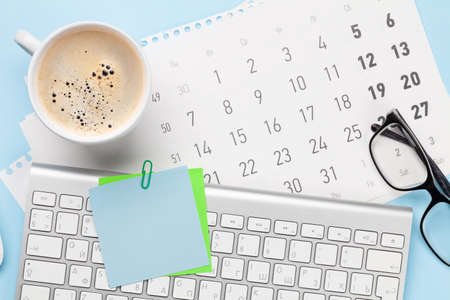 Business desk workplace and office objects over blue backdrop. Top view flat lay with copy space for your textの写真素材