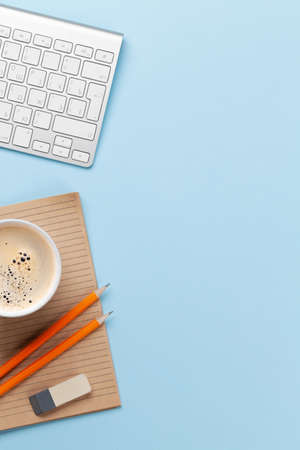 Business desk workplace and office objects over blue backdrop. Top view flat lay with copy space for your textの写真素材