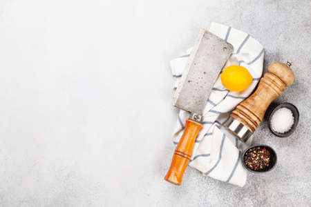 Cooking utensils and spices on kitchen table. Top view flat lay with copy space