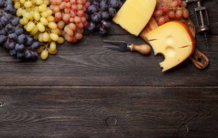 Various grapes and cheese. Top view flat lay with copy spaceの写真素材