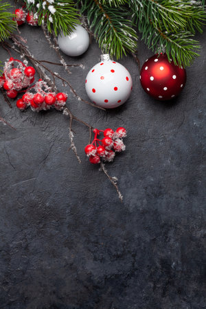 Christmas greeting card with fir tree and decor. Top view flat lay with copy space for your xmas greetingsの写真素材