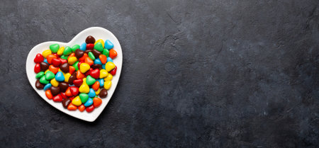 Heart shaped candies. Valentines day card. Top view flat lay with space for your greetingsの写真素材