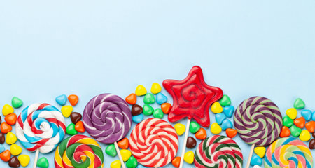 Various candy sweets and lollipop. Top view flat lay with copy spaceの写真素材