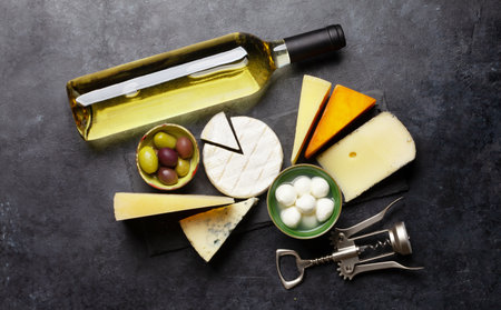 Various cheese, olives and wine. Top view flat lay