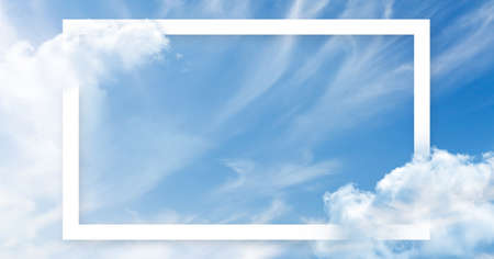 Frame with copy space over blue sky with light clouds backdrop