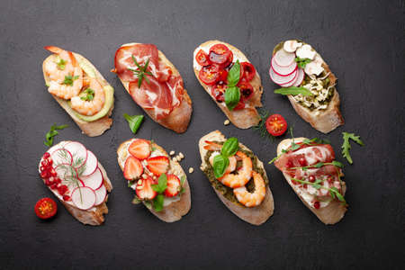 Appetizers board with traditional spanish tapas set. Italian antipasti bruschetta snacks. Top view flat layの写真素材