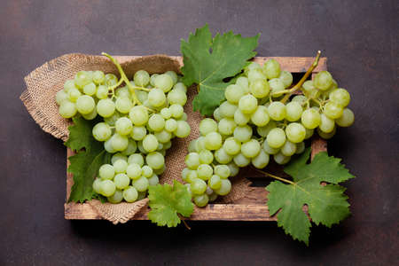 White grape in wooden box. Top view flat lay