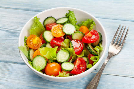 Fresh salad with garden tomato and cucumber. Top viewの写真素材