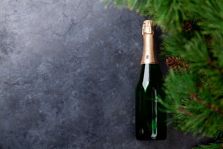 Christmas fir tree and champagne. Top view flat lay with copy space for your greetingsの写真素材