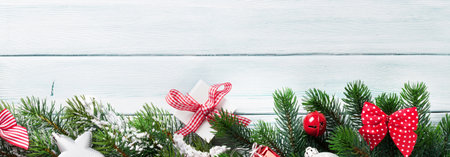 Christmas wooden background with fir tree and decoration. Top view flat layの写真素材
