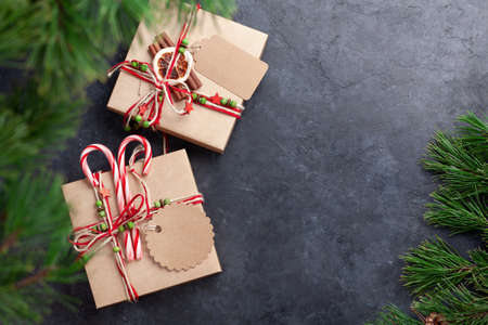 Christmas gift boxes with craft decor. Top view flat lay with copy space for your greetingsの写真素材
