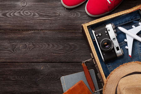 Travel and vacation concept. Luggage with trip items and clothes. Top view flat lay with copy spaceの写真素材