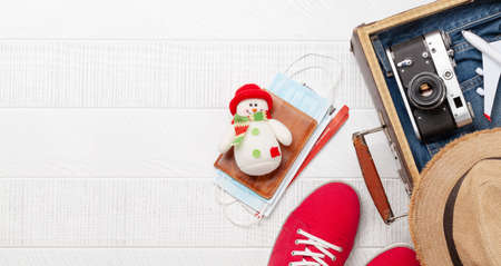 Travel and vacation concept. Trip accessories and items. Christmas journey. Top view flat lay with copy spaceの写真素材