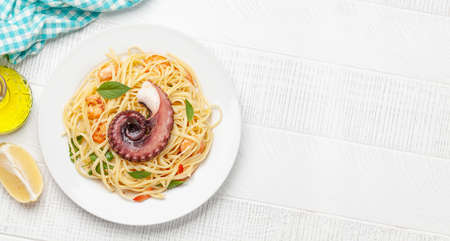 Seafood pasta with octopus and shrimps. Top view flat lay with copy spaceの写真素材