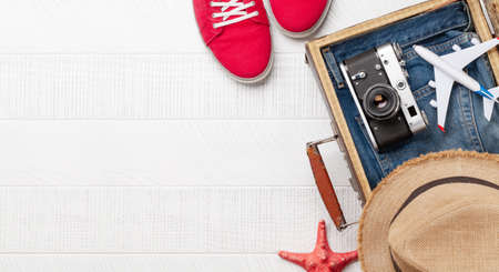 Travel and vacation concept. Luggage with trip items and clothes. Top view flat lay with copy spaceの写真素材