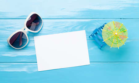 Travel and vacation concept. Sunglasses and blank card for your text or photo