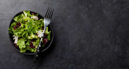 Leaf salad in bowl. Top view flat lay with copy spaceの写真素材