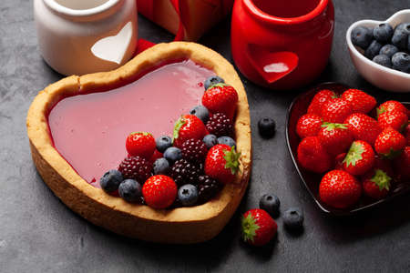 Heart shaped sweet cake with berries. Valentines Day greeting cardの写真素材