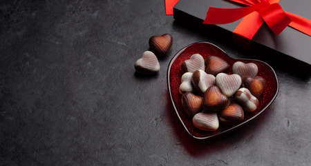 Valentines day heart shaped chocolate sweets and gift box. Top view with copy spaceの写真素材