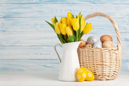 Easter greeting card with tulips and easter eggs. With space for your greetings