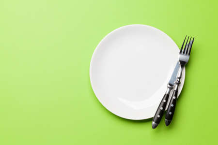 Empty plate and silverware. Top view flat lay with copy space. Template or mockup for your meals