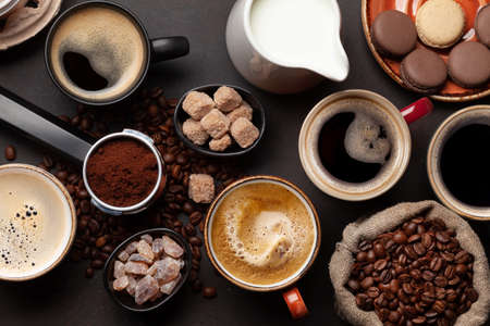 Fresh cappuccino and espresso coffee, roasted coffee beans, sugar and milk. Top view flat layの写真素材