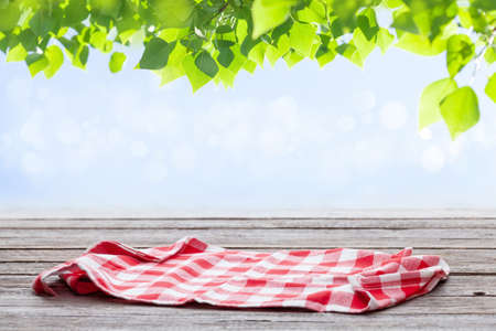 Wooden table with tablecloth and copy space for your productの写真素材