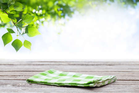 Wooden table with tablecloth and copy space for your productの写真素材