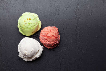 Various ice creams. Strawberry, pistachio and vanilla icecream. Flat lay with copy spaceの写真素材
