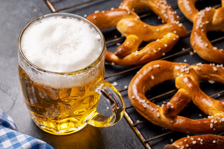 Freshly baked homemade pretzels and draft beerの写真素材