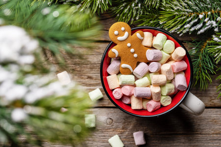 Gingerbread man in a cup with marshmallow. christmas holiday