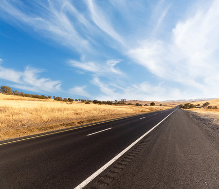 Asphalt road and countryside landscape of United Statesの写真素材
