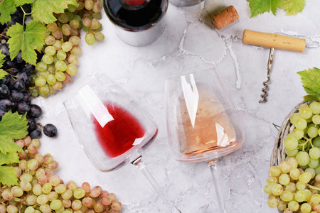 White, rose and red wine bottles and glasses. flat lay
