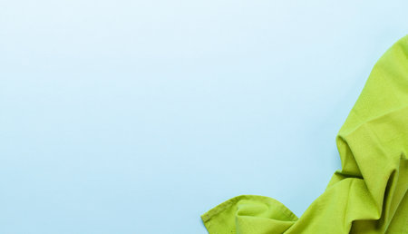 Kitchen tablecloth. Cooking towel on blue background. Top view flat lay with copy spaceの写真素材