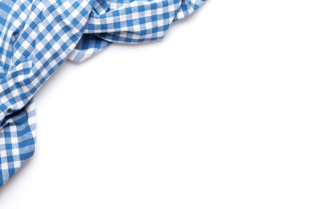 Kitchen tablecloth. Cooking towel isolated on white background. Top view flat lay with copy spaceの写真素材