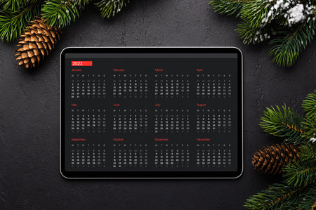 Tablet with calendar and Christmas decor. Xmas device screen templateの写真素材
