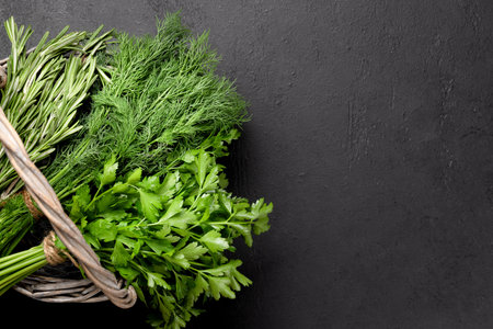 Various garden herbs basket. Basil, dill, parsley, rosemary. Flat lay with copy spaceの写真素材