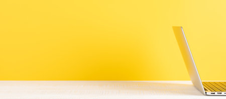 Laptop on wooden table. Computer on desk with blank space for your textの写真素材