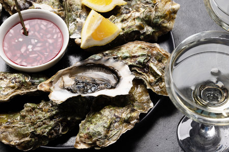 Fresh oysters with glasses of sparkling wine. close upの写真素材