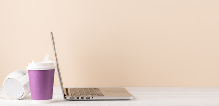 Laptop, headphones and coffee cup. Computer on desk with blank space for your textの写真素材