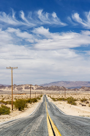 The perspective of a never-ending road, the journey of travel and adventure towards a beautiful destinationの写真素材