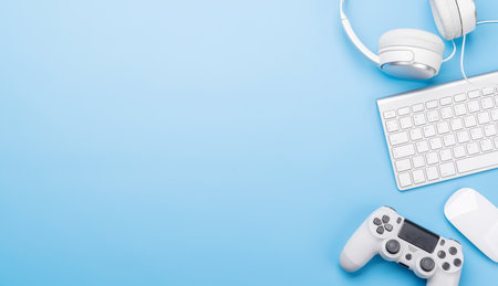 Gaming gear and tech accessories on a blue background, perfect for gaming and tech-related themes....