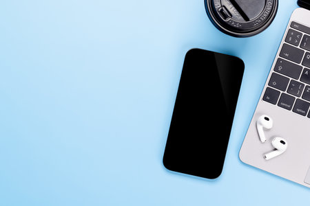 Blank black screen smartphone on a desk, perfect for your design mockupの写真素材