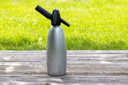 Refreshing homemade lemonade siphon on an outdoor garden table. Cold summer drink. With copy spaceの写真素材