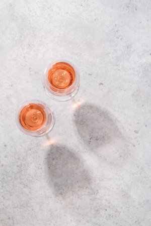 Refreshing rose wine on the table on a sunny day, the perfect summer vacation. View from above with space for your textの写真素材