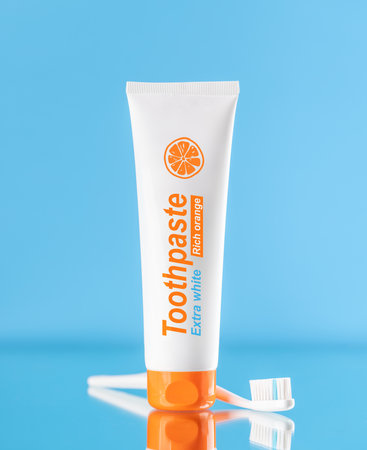 A clean and refreshing image featuring toothpaste and toothbrush, promoting oral hygiene and a bright smileの写真素材