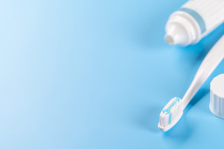 A clean and refreshing image featuring toothpaste and toothbrush, promoting oral hygiene and a...